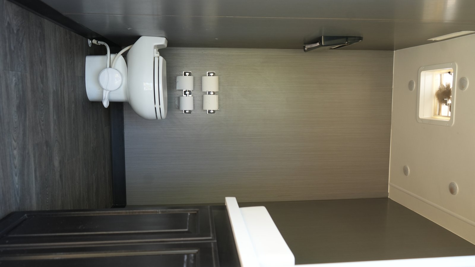 Spacious restroom stall with LED lighting and window